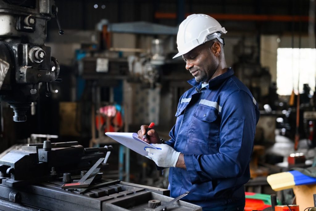professional-male-industrial-worker-in-white-hard-hat-working-at-manufacturing.jpg